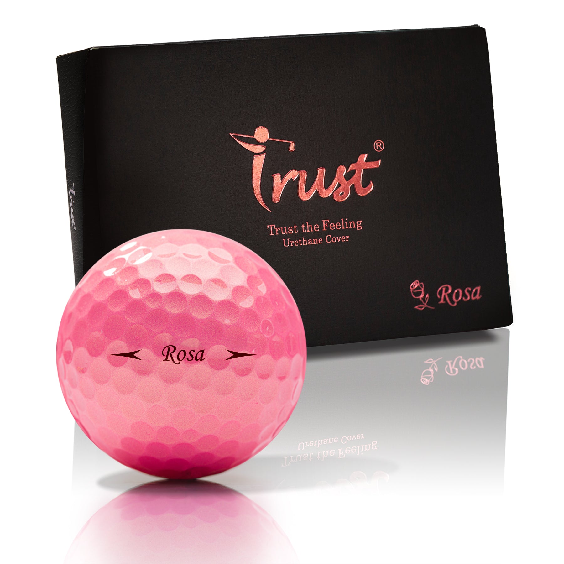 Pink golf ball with 'Trust' branding and a matching box on a white background